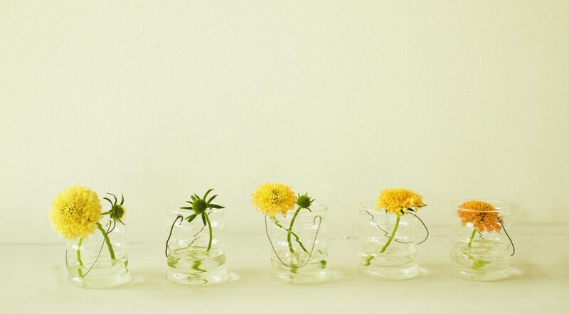 Yellow flowers in glass vases