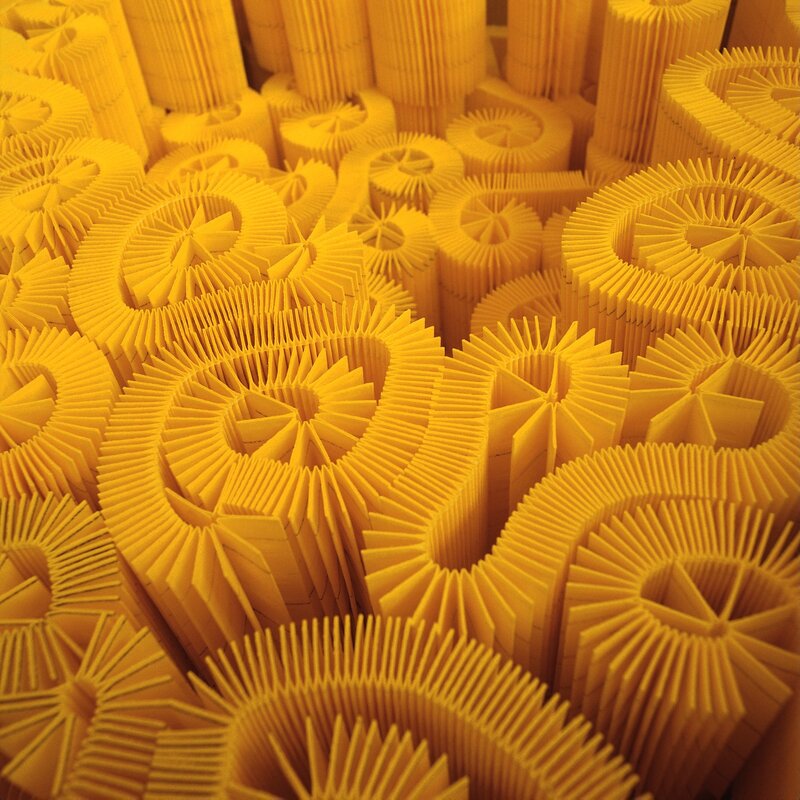 Yellow folded paper sculptures