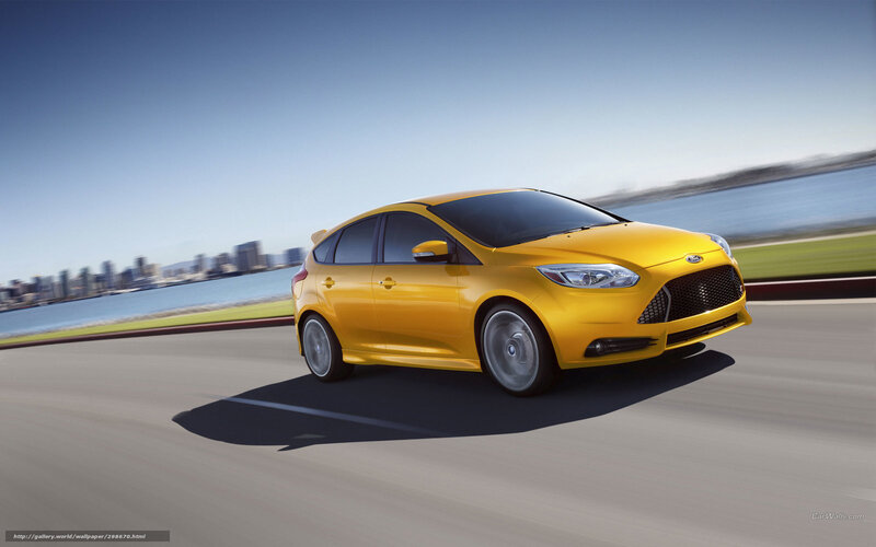 Yellow Ford Focus in motion