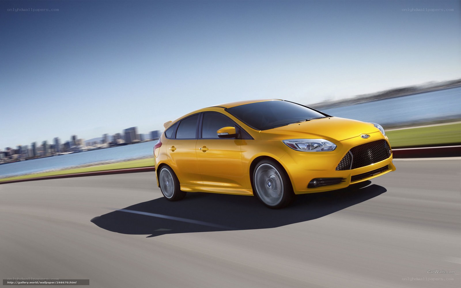 Yellow Ford Focus in motion