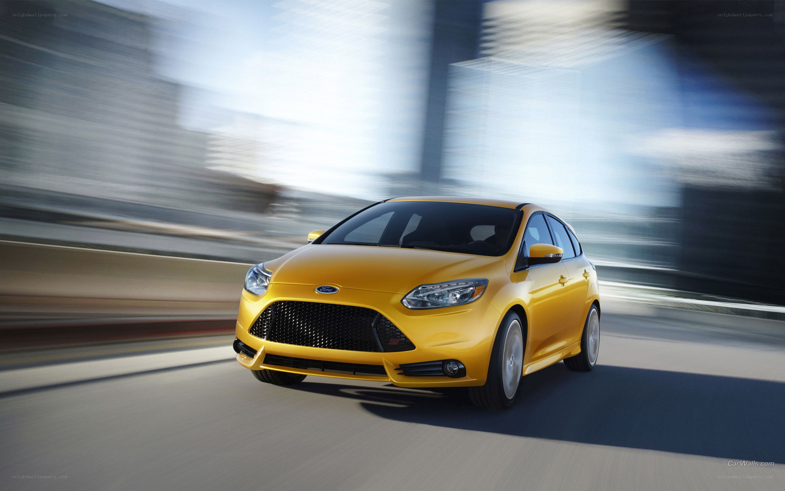 Yellow Ford Focus ST in motion