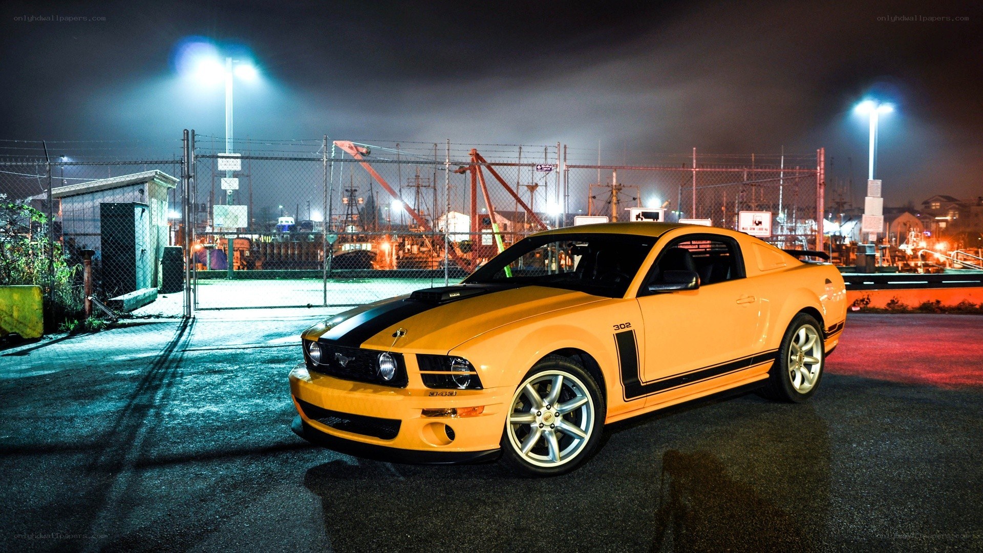Yellow Ford Mustang at night