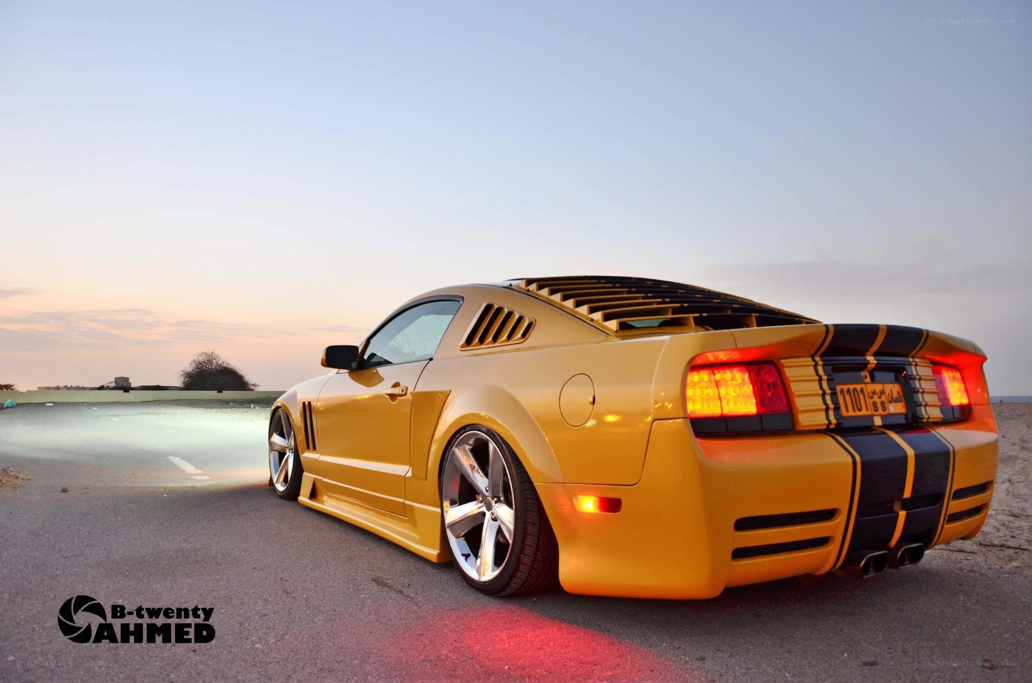 Yellow Ford Mustang at sunset