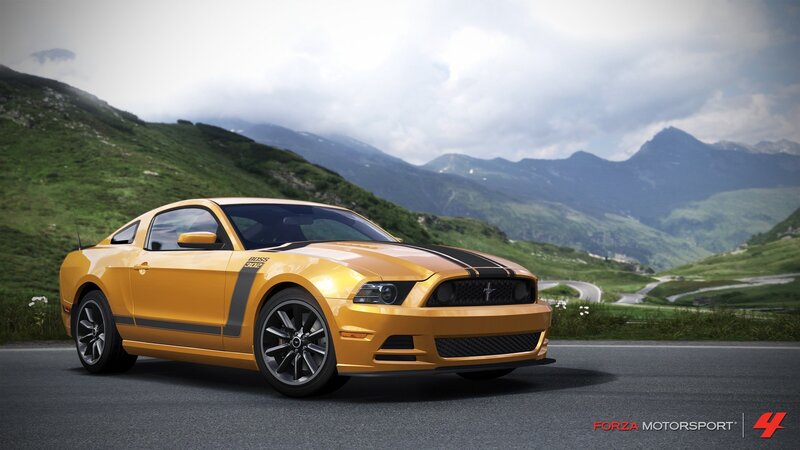 yellow ford mustang on mountain road