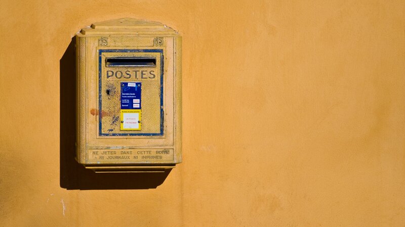yellow french mailbox