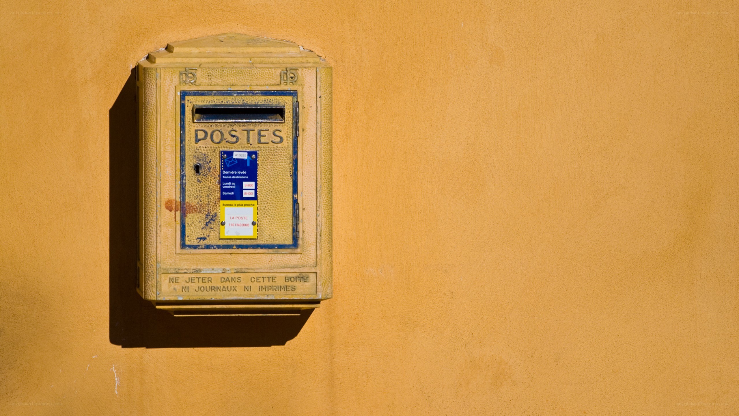 yellow french mailbox