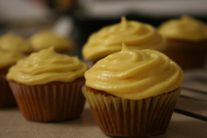 Yellow-frosted cupcakes