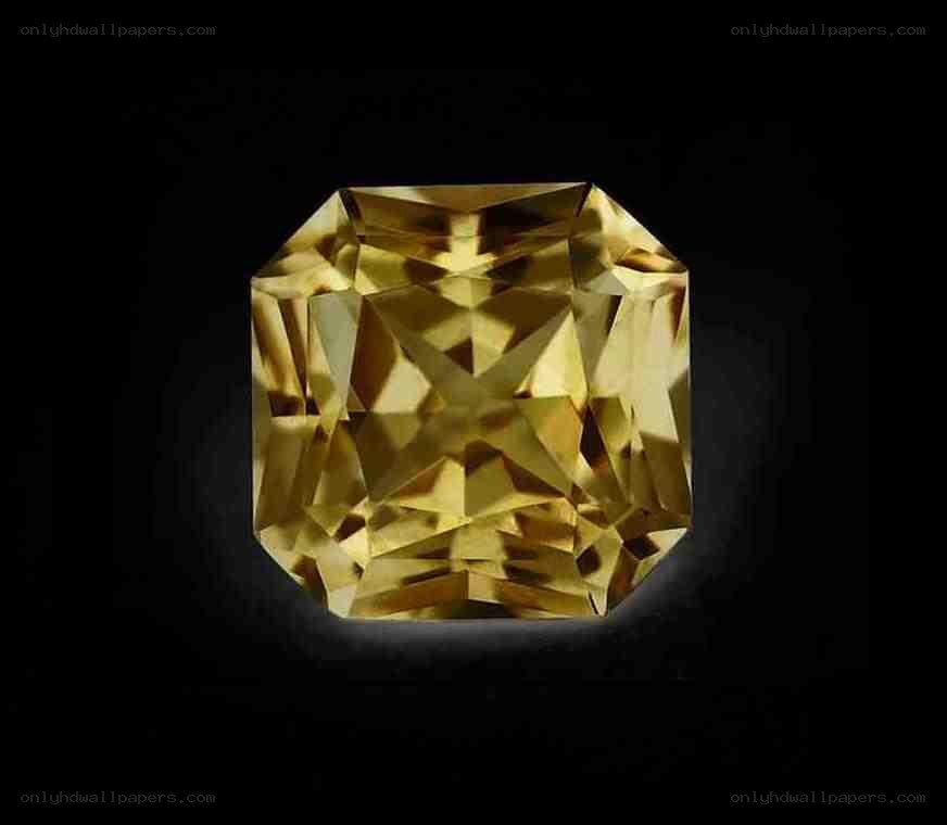 yellow gemstone on black background