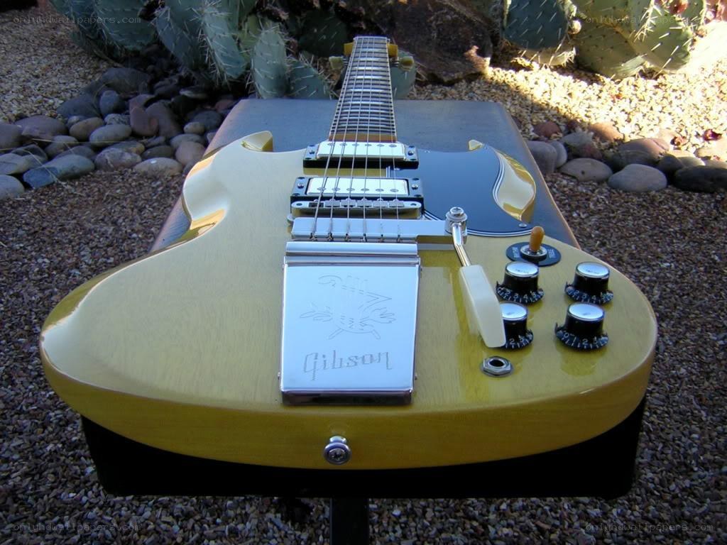 yellow gibson electric guitar