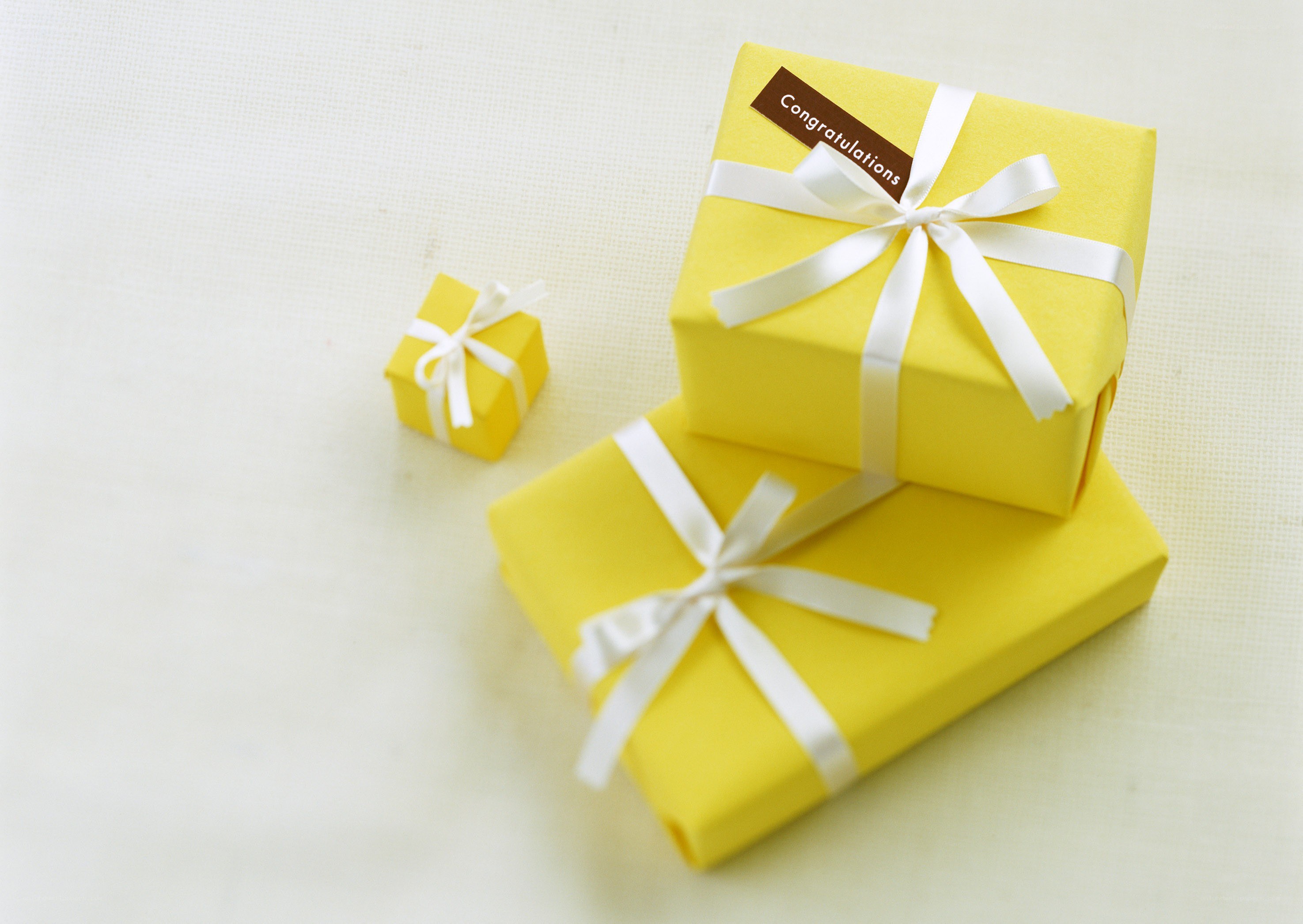 Yellow gift boxes with ribbons