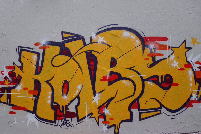Yellow Graffiti on Wall