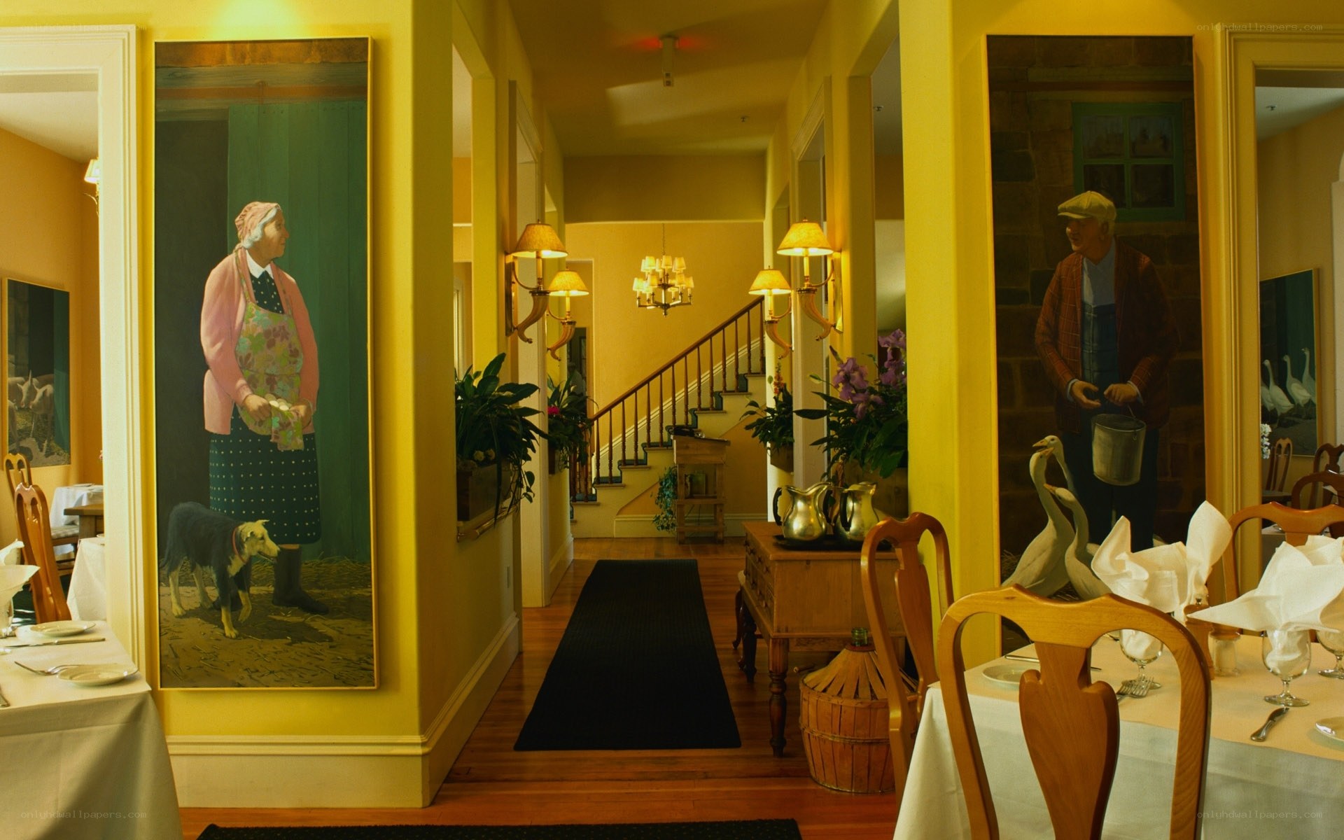 yellow hallway with portraits