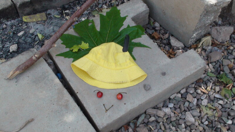 Yellow hat with leaf and cherries