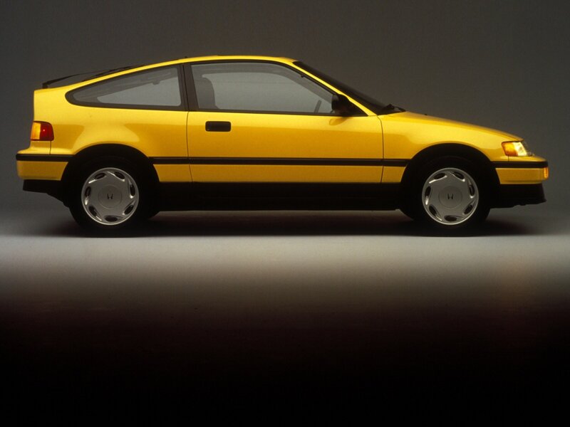 Yellow Hatchback Car — Dramatic, Photograph, Wheels