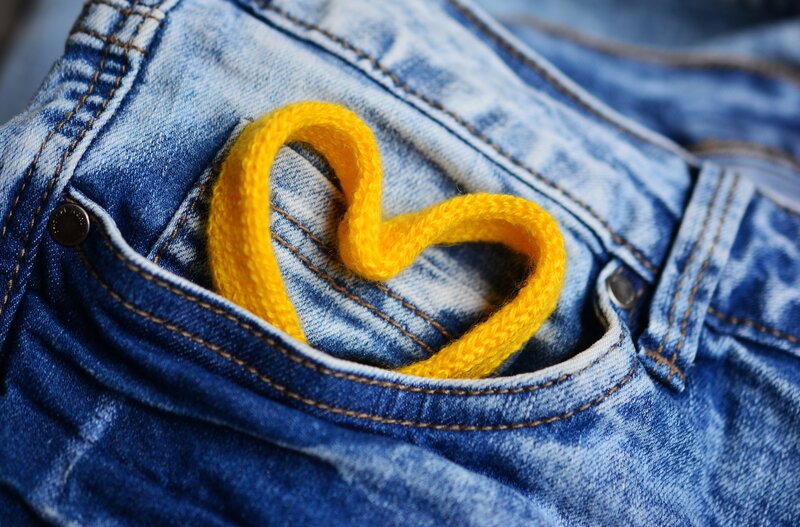 yellow heart in jeans pocket