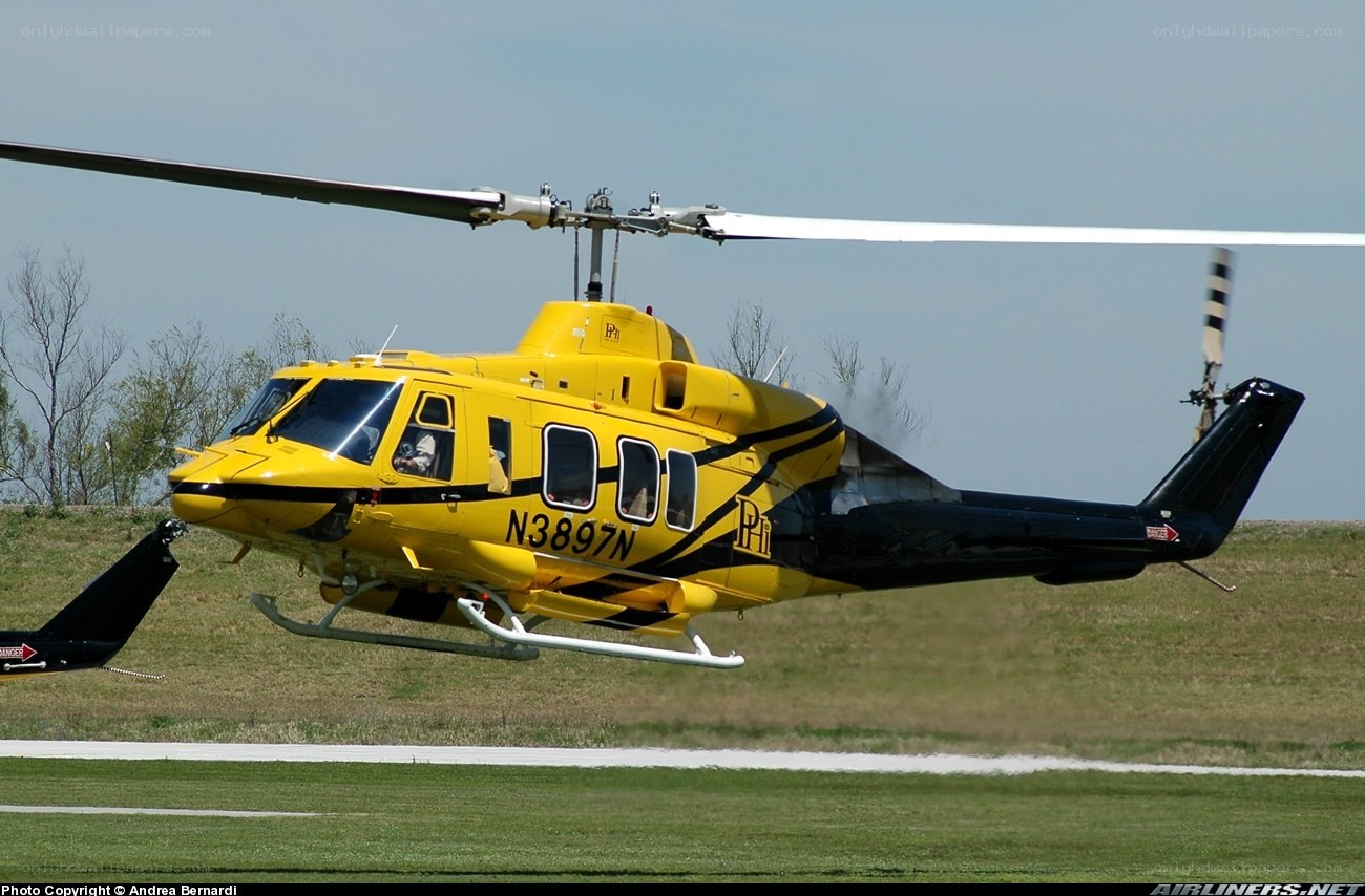 Yellow helicopter in flight