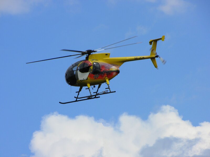 Yellow Helicopter in Flight — Blue