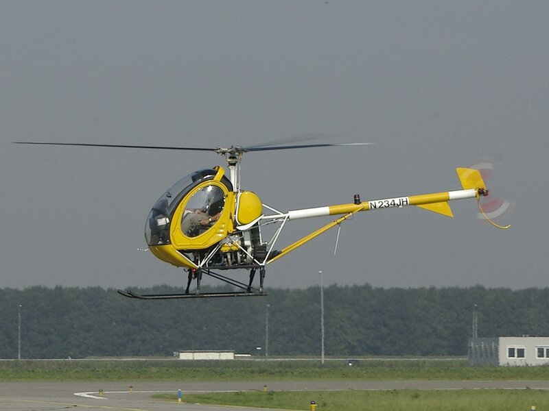 Yellow Helicopter in Flight — Calm, Afternoon, Photograph