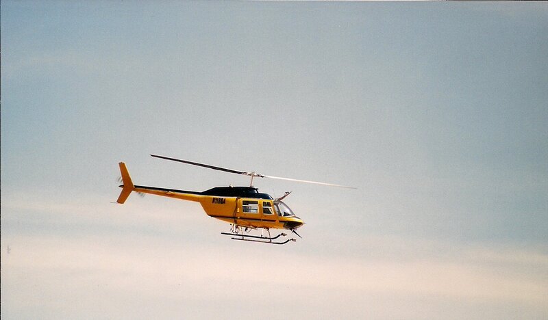 Yellow Helicopter in Flight — Calm