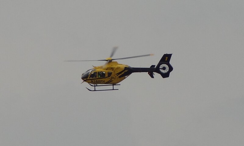 Yellow Helicopter in Flight — Overcast, Photograph