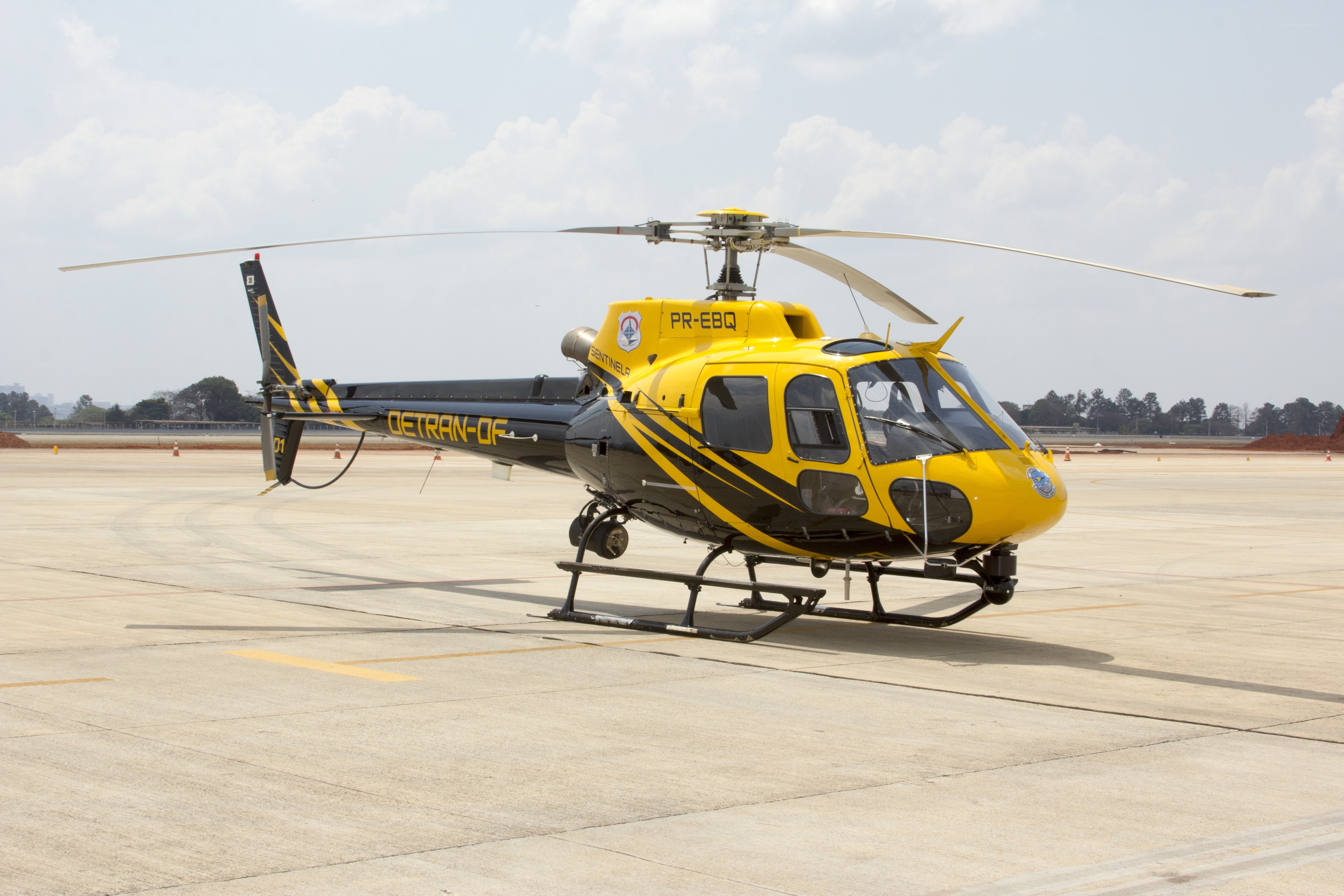 Yellow helicopter on tarmac