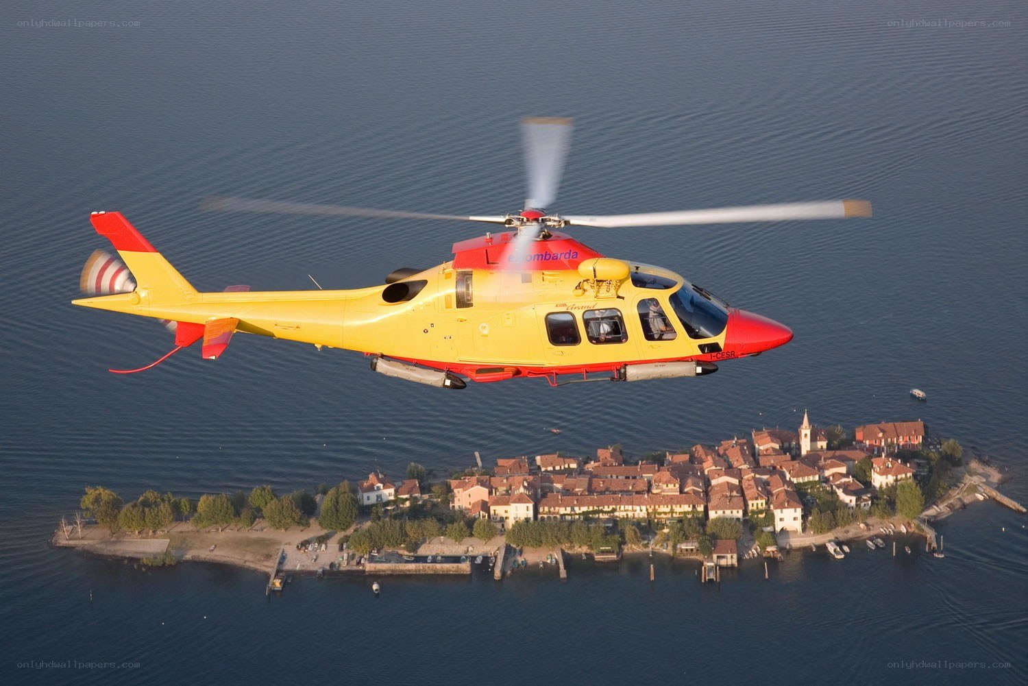 Yellow helicopter over lake island