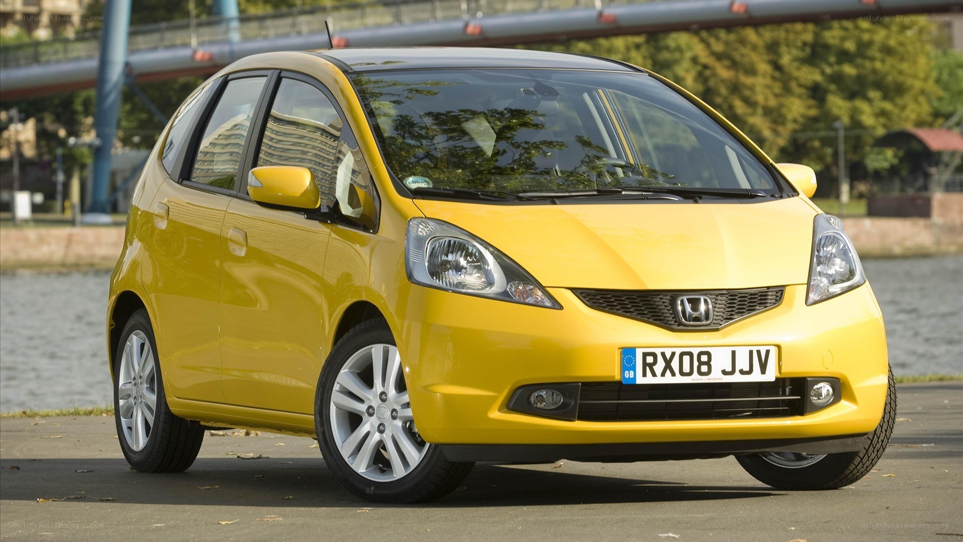 yellow honda fit hatchback