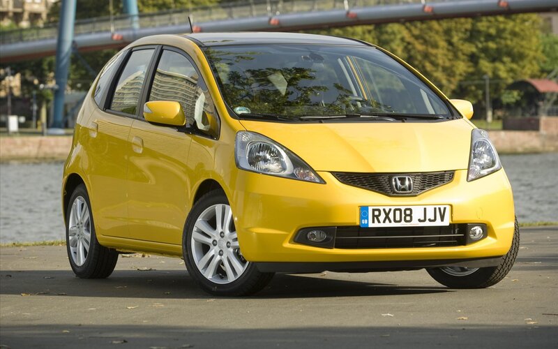 yellow honda jazz car