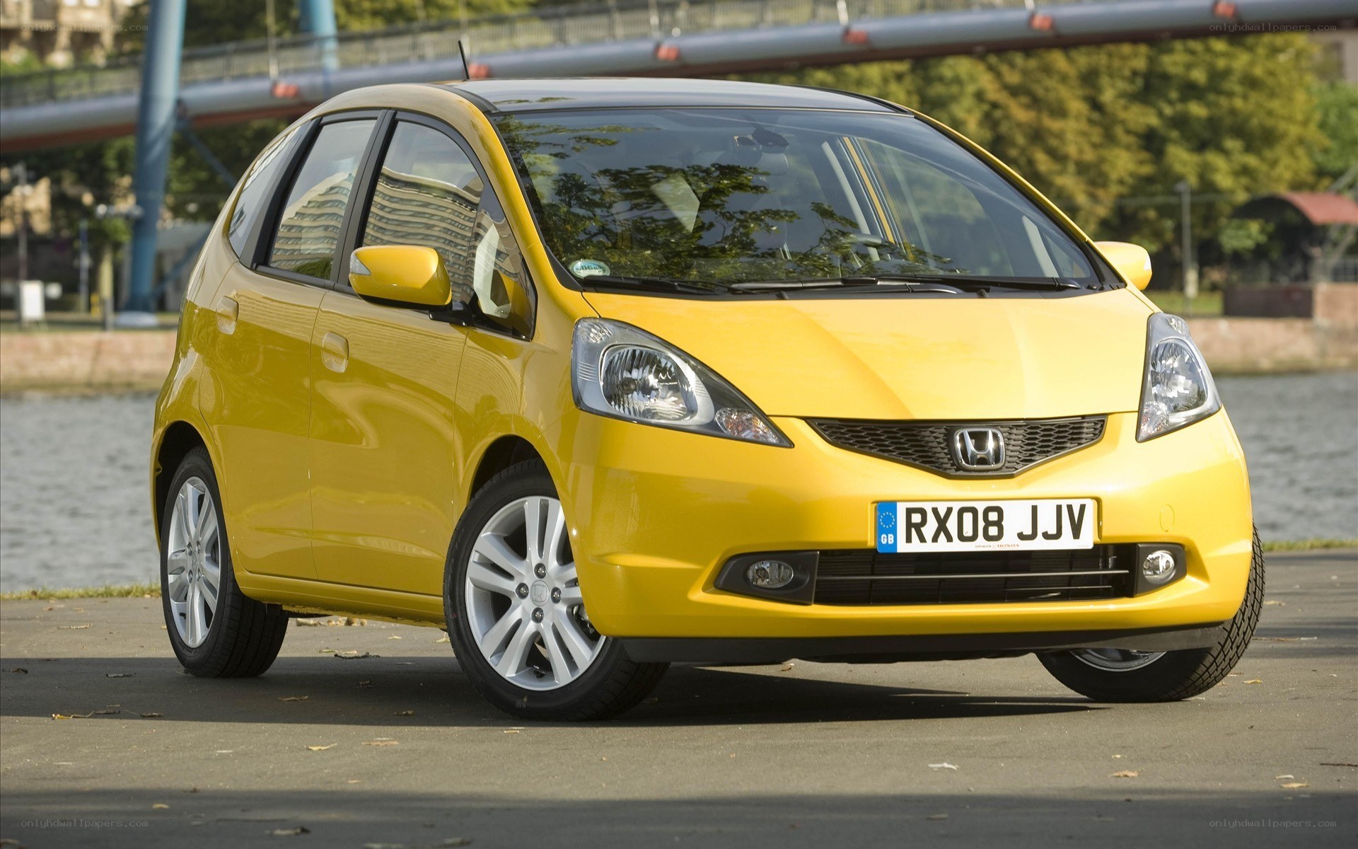 yellow honda jazz car