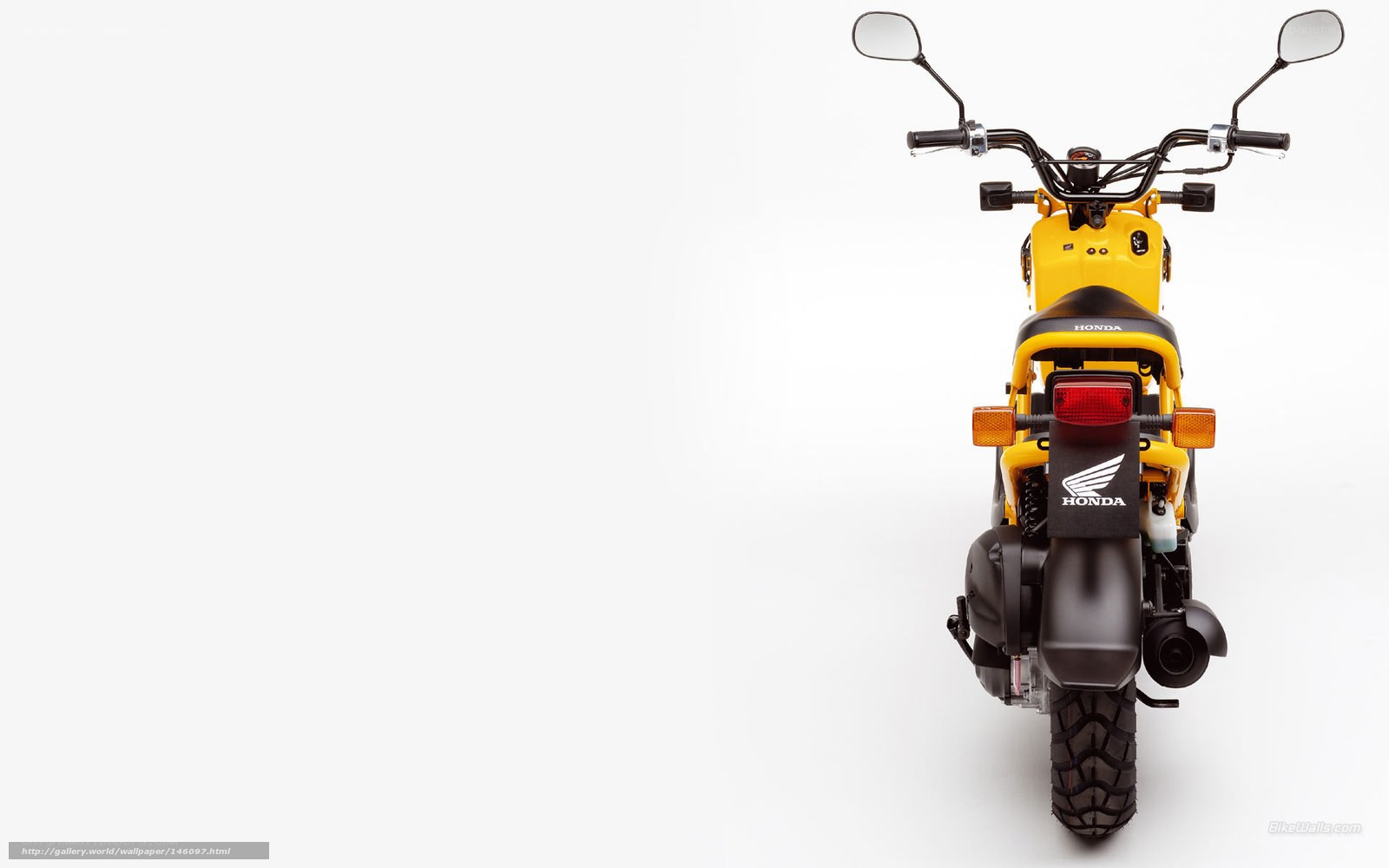 Yellow Honda motorcycle rear view