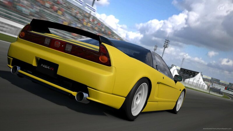 yellow honda nsx-r on racetrack