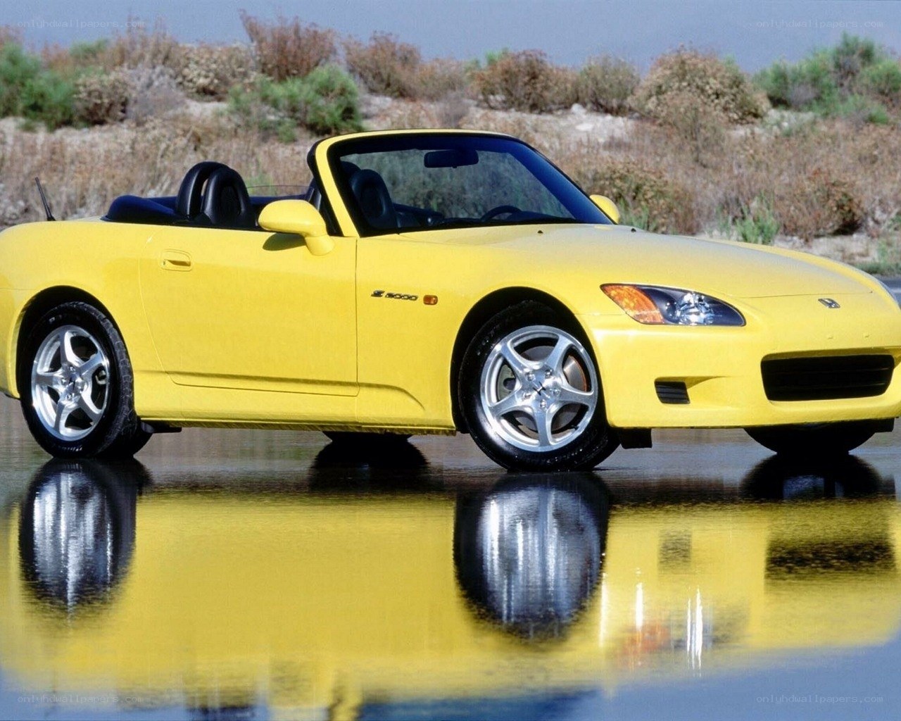 Yellow Honda S2000 convertible