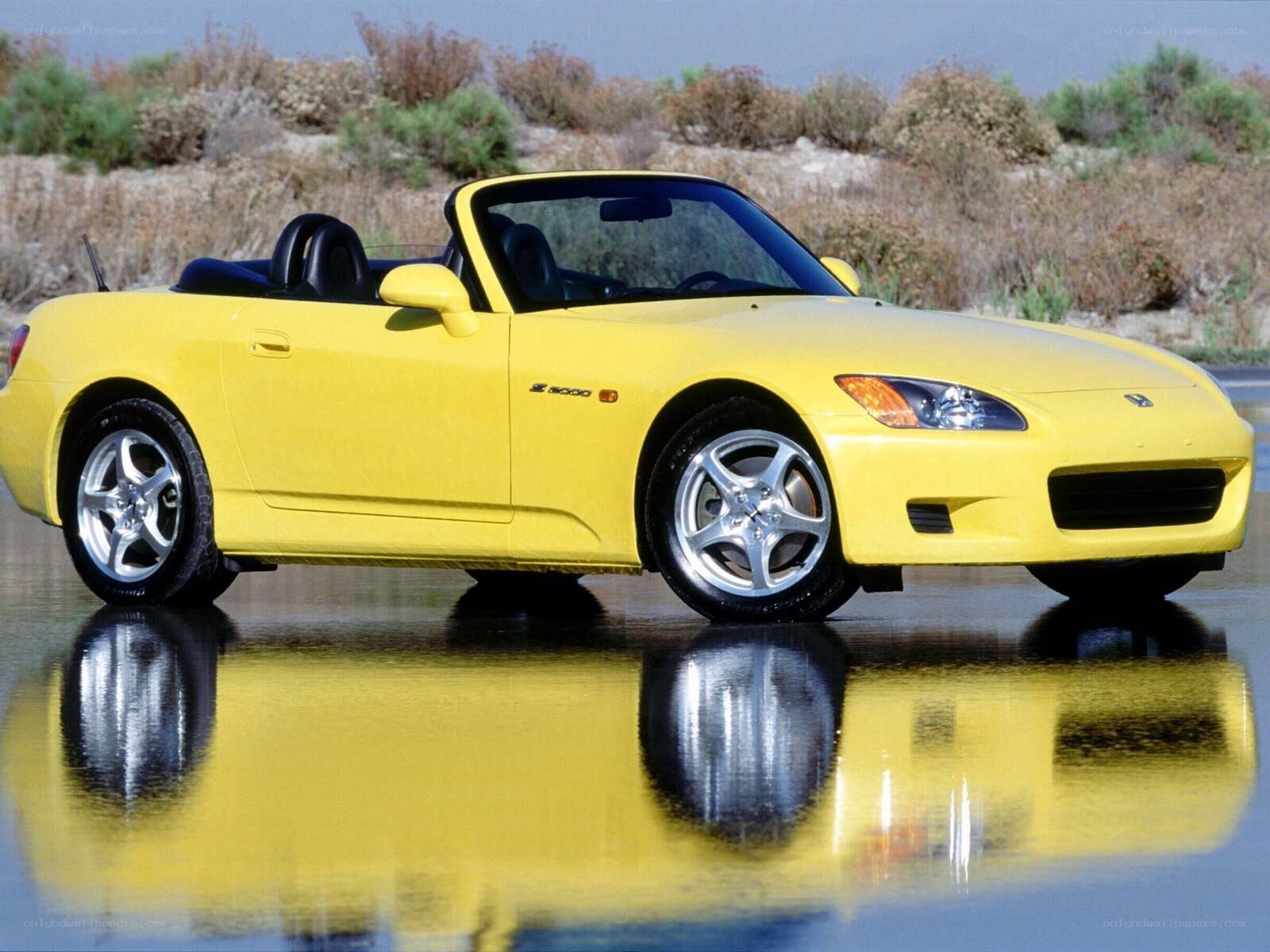 Yellow Honda S2000 convertible
