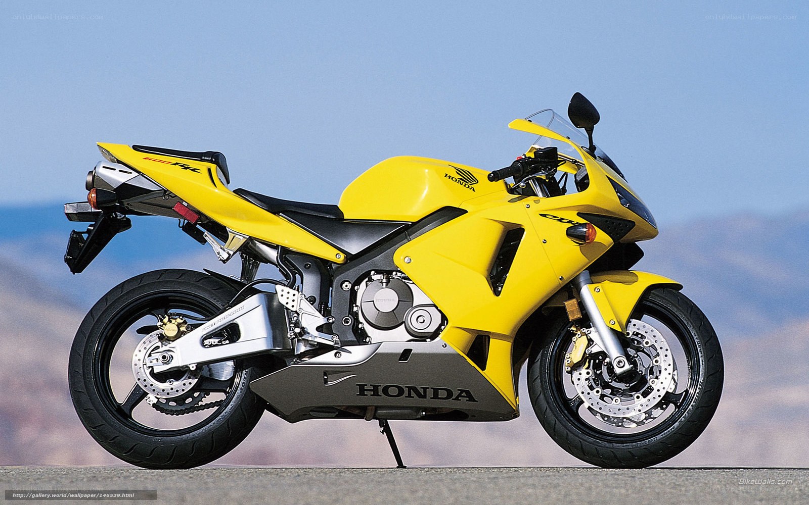 yellow honda sport motorcycle