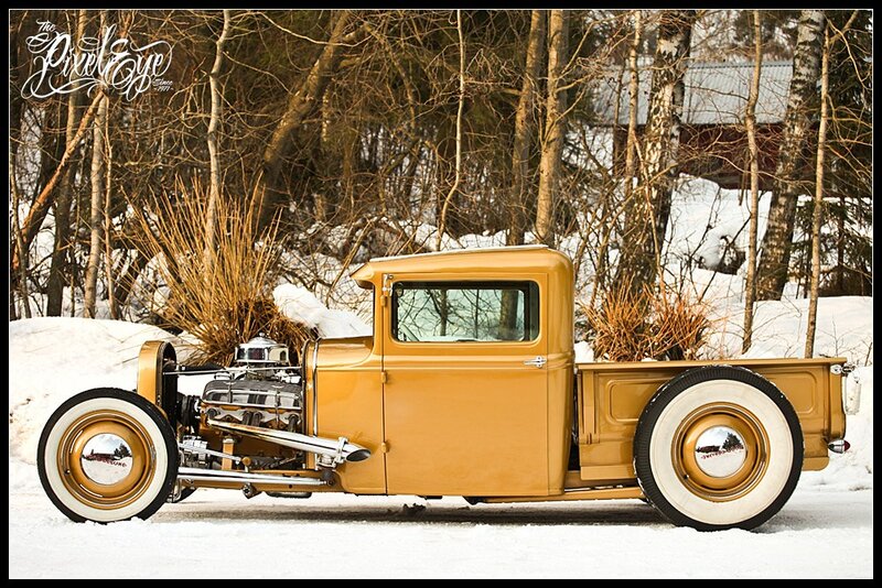 Yellow hot rod truck in snow