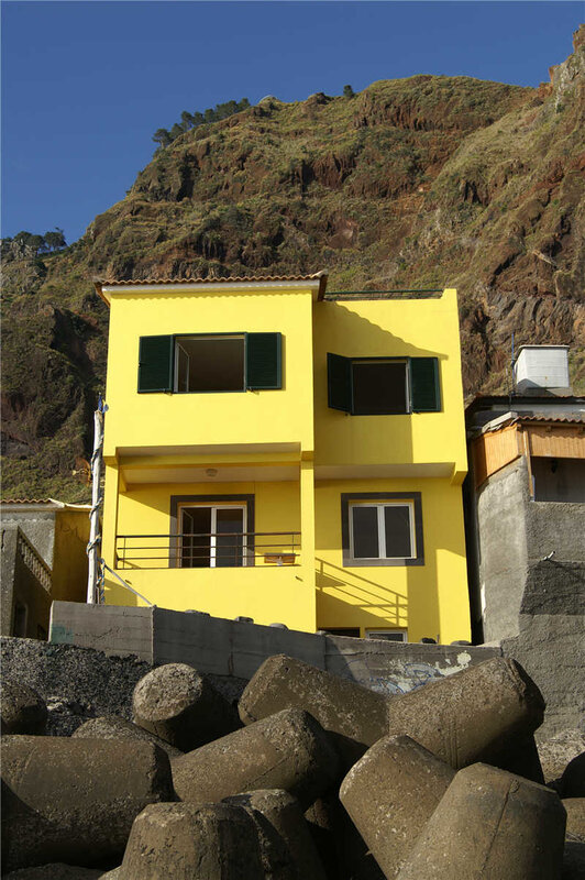 Yellow house by the sea