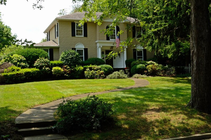 Yellow House with American Flag
