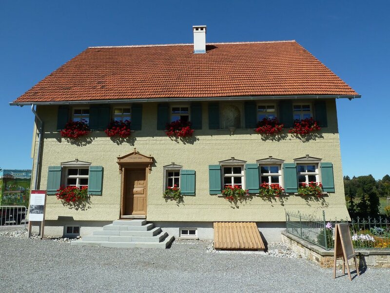 Yellow House with Flowers