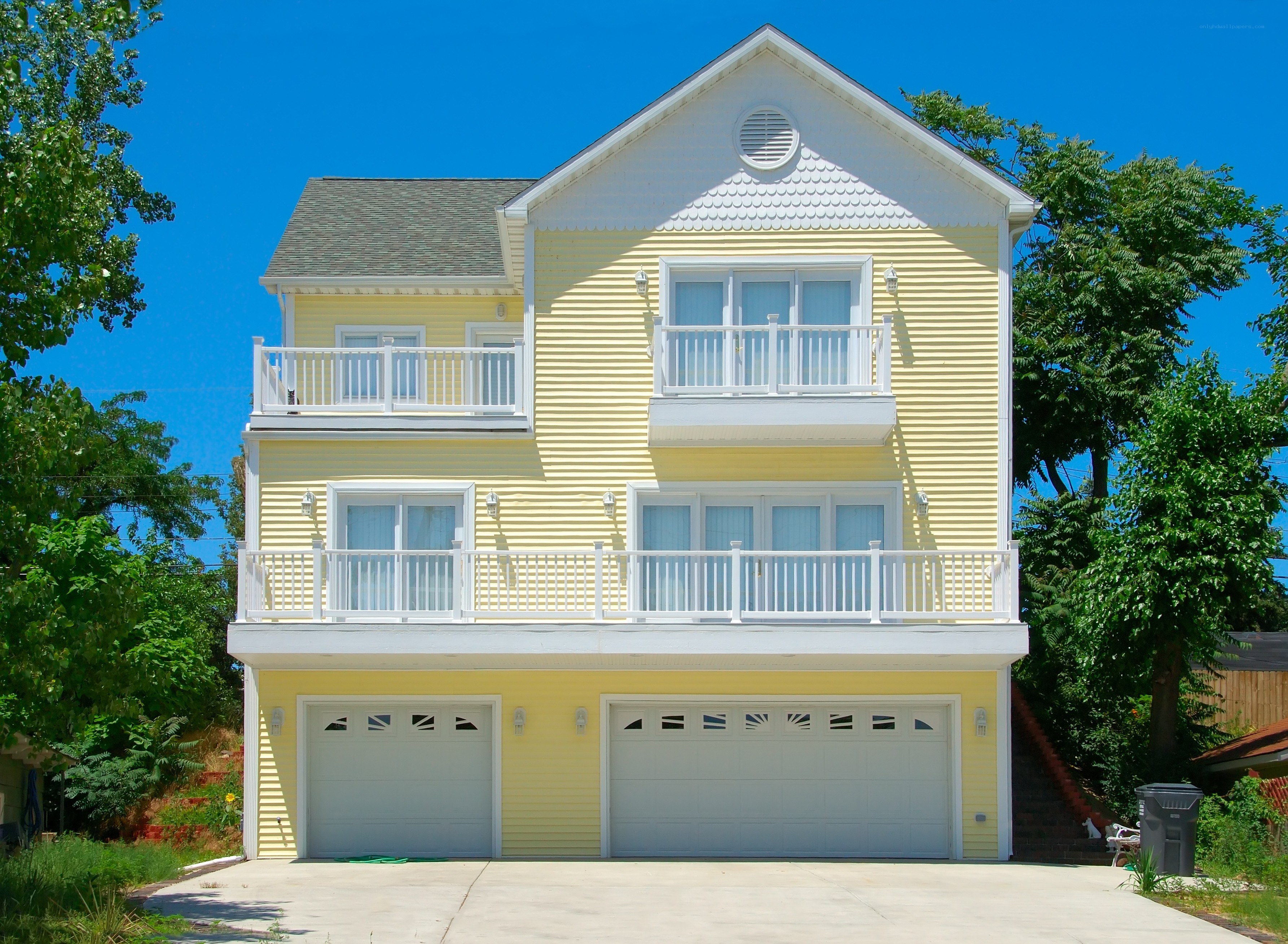yellow house with garage
