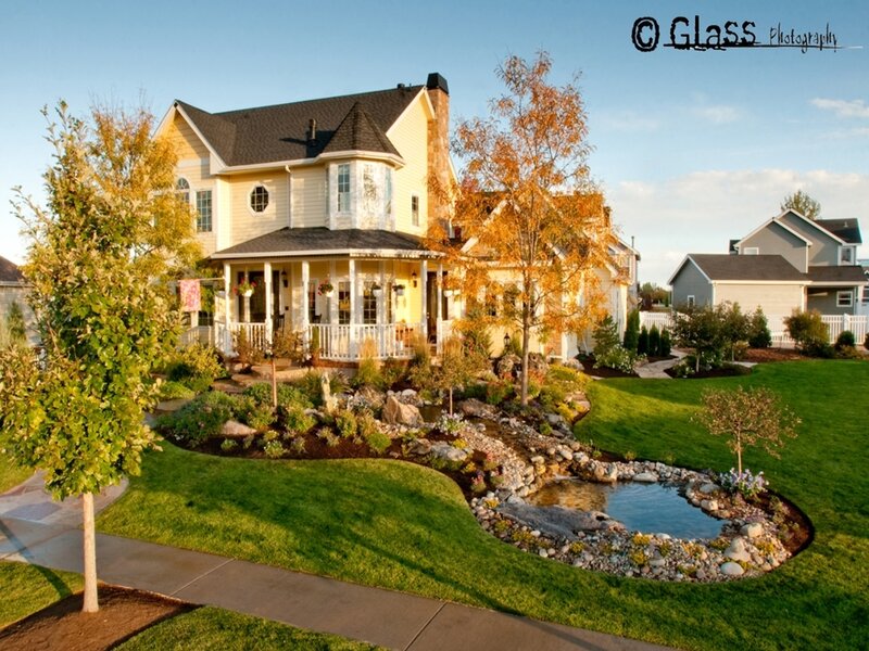 Yellow house with garden pond