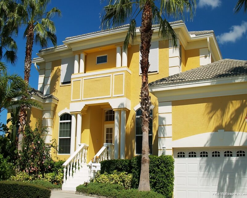 yellow house with palm trees