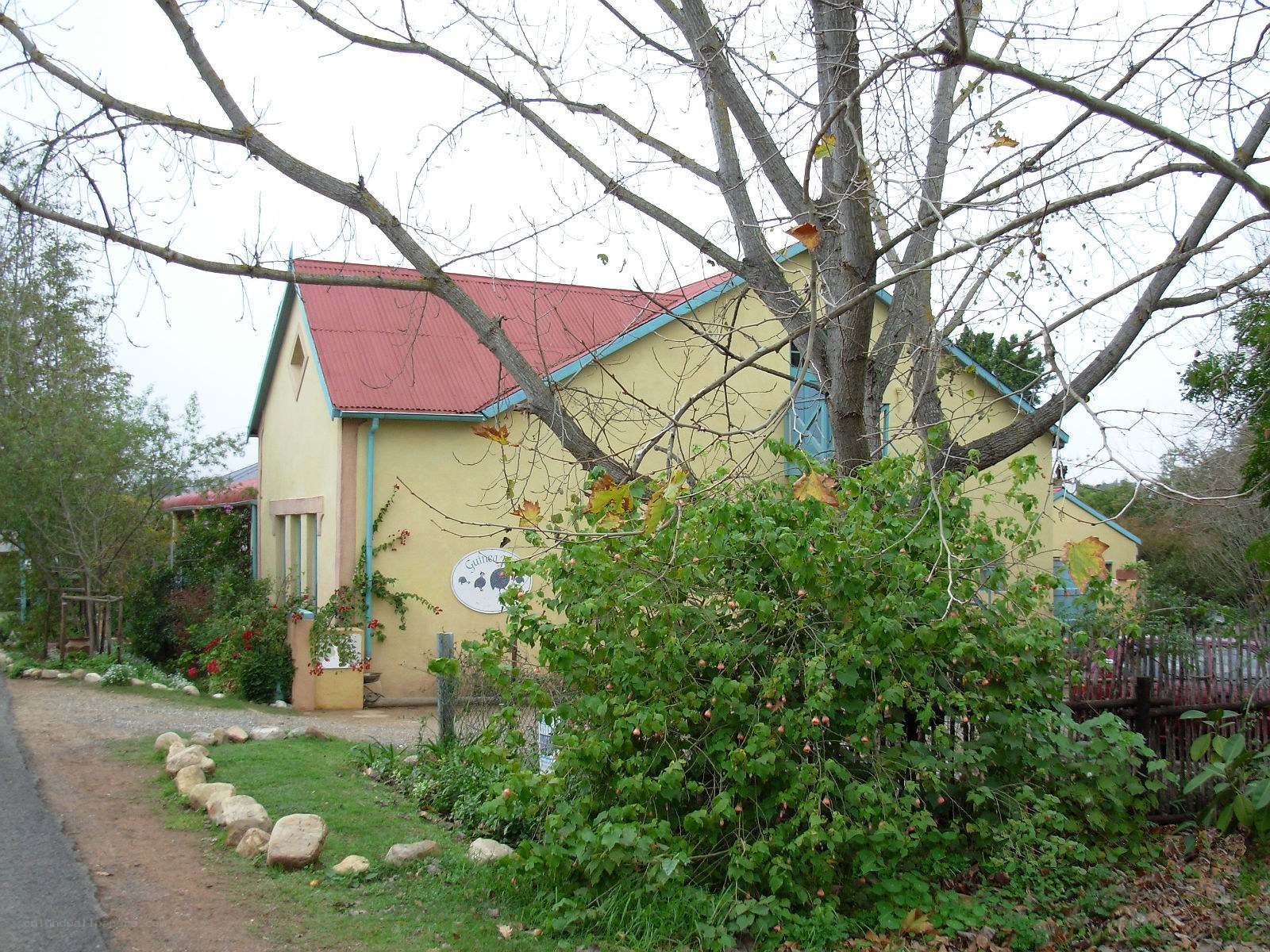 yellow house with red roof
