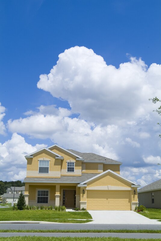 Yellow house with white clouds