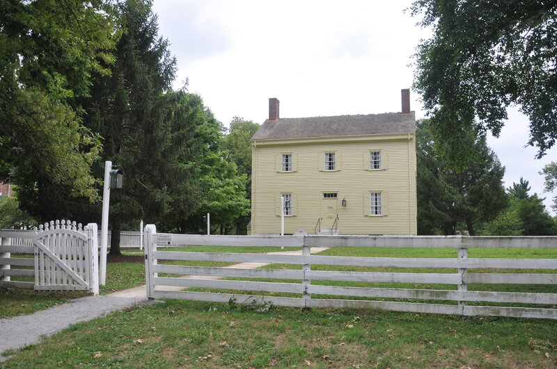 Yellow House with White Fence
