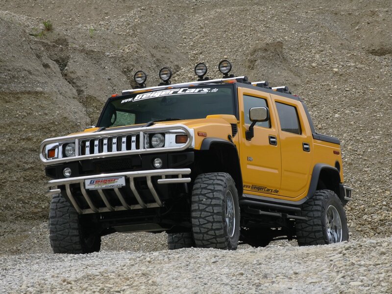 Yellow Hummer H2 in rocky terrain