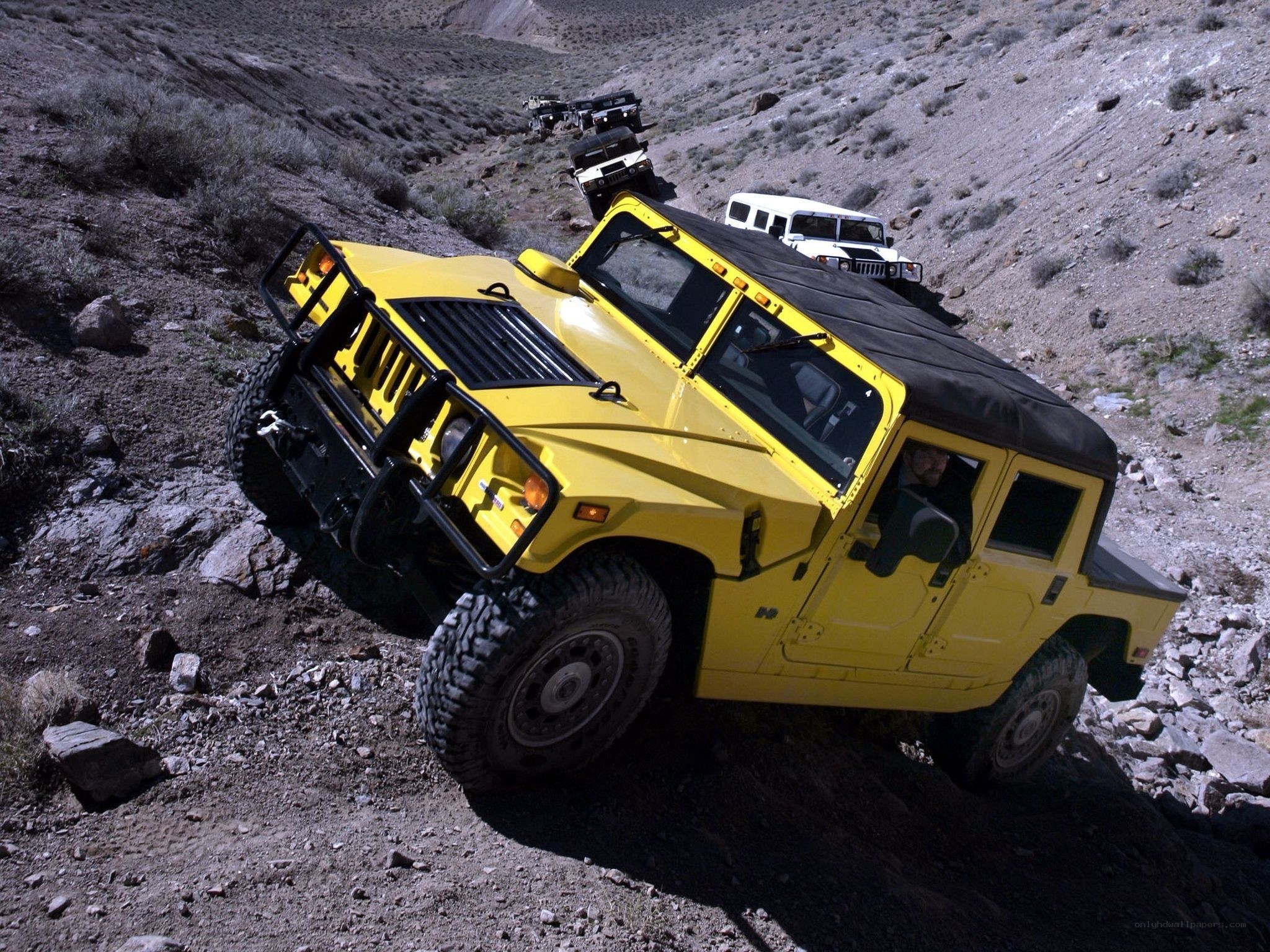 Yellow Hummer off-roading