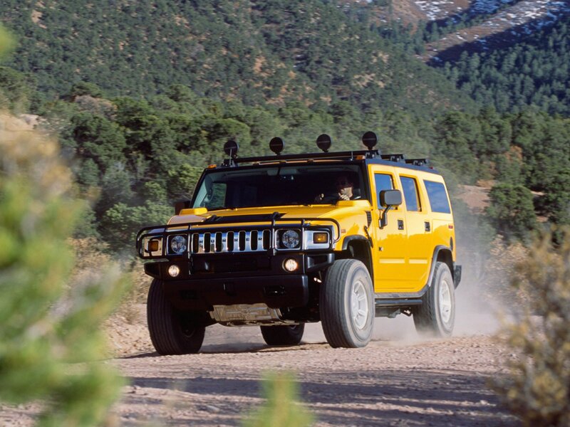 Yellow Hummer on dirt road