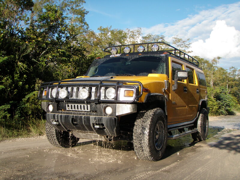 Yellow Hummer on muddy road