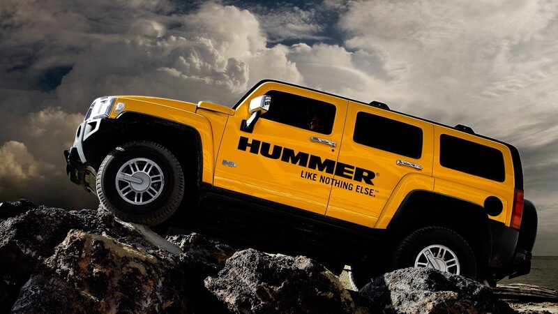 Yellow Hummer on rocky terrain