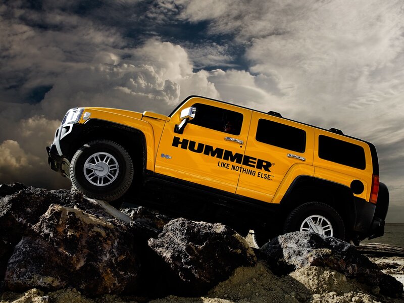 Yellow Hummer on rocky terrain